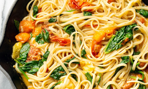 Spinach Tomato Linguine served hot in a pasta bowl